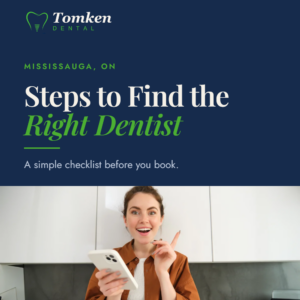 Woman holding phone and smiling - steps to find the right dentist in Mississauga, Tomken Dental