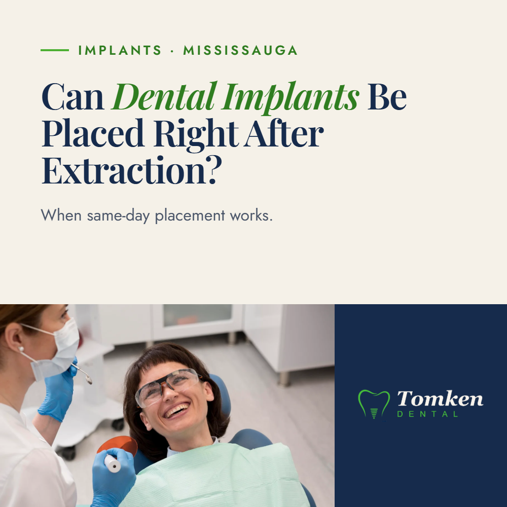 Dentist and smiling patient discussing dental implants placed right after tooth extraction - Tomken Dental Mississauga
