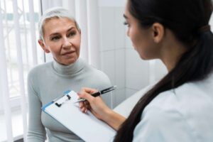 Dentist discussing oral health concerns with a patient during a one-on-one dental consultation