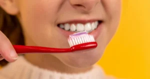 girl brushing her teeth